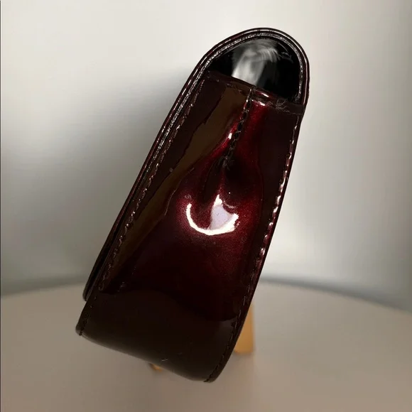 Louis Vuitton Burgundy Sobe clutch with Brass Hardware